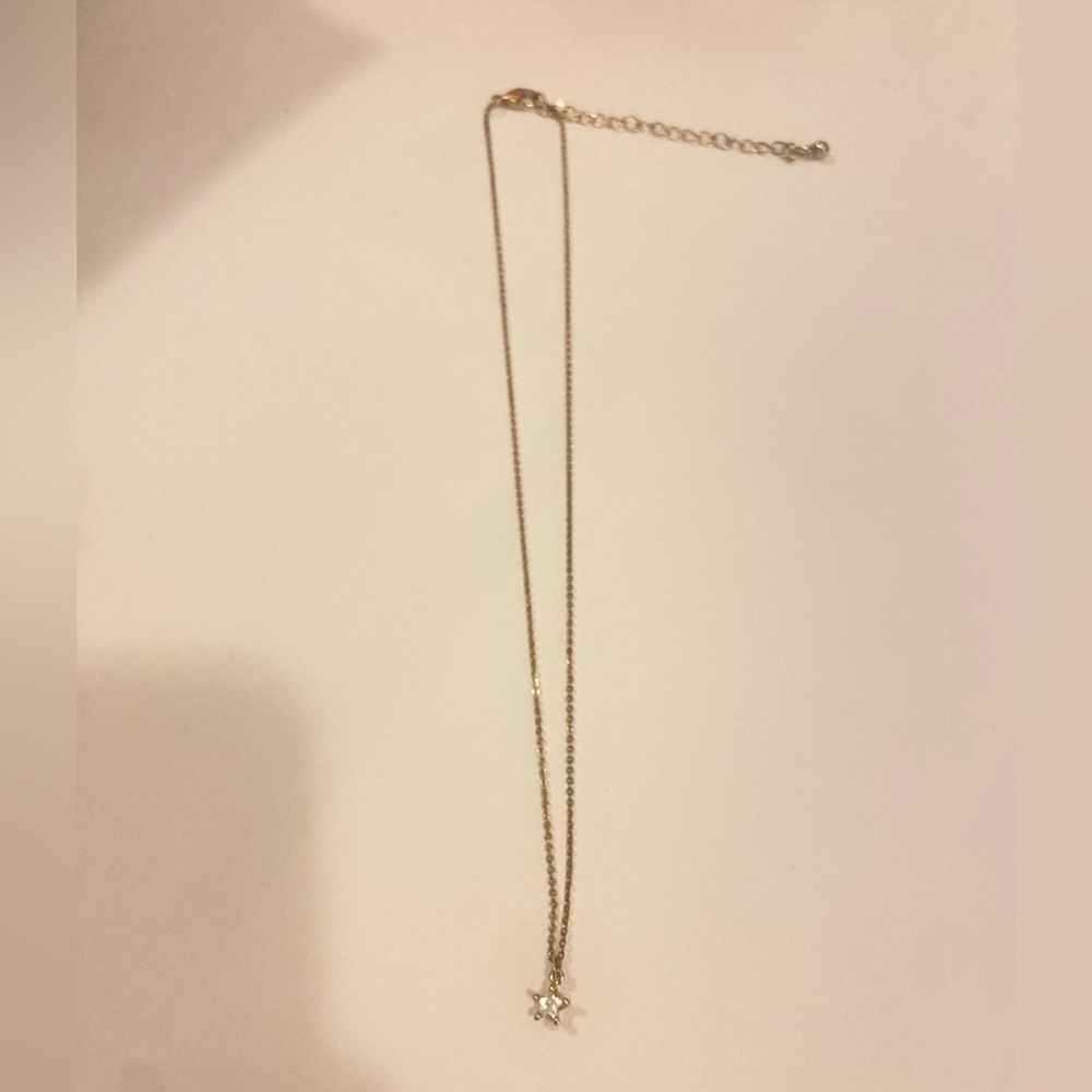 Gold necklace with diamond star